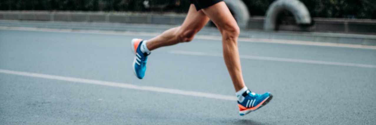 pair of blue-and-white Adidas running shoes